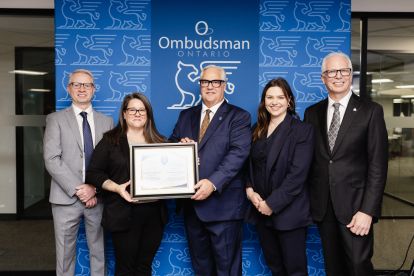 Ombudsman presenting Good Governance Award to Deputy Minister of Transportation Doug Jones (far right) and team