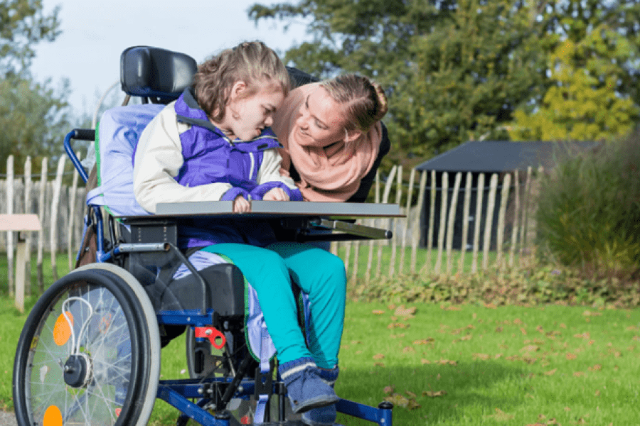 Child in wheelchair with mother