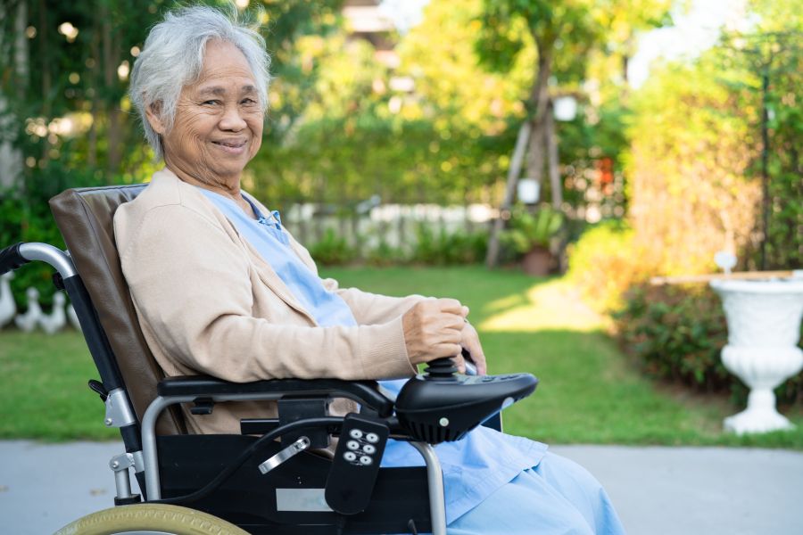 Person sitting in motorized wheelchair