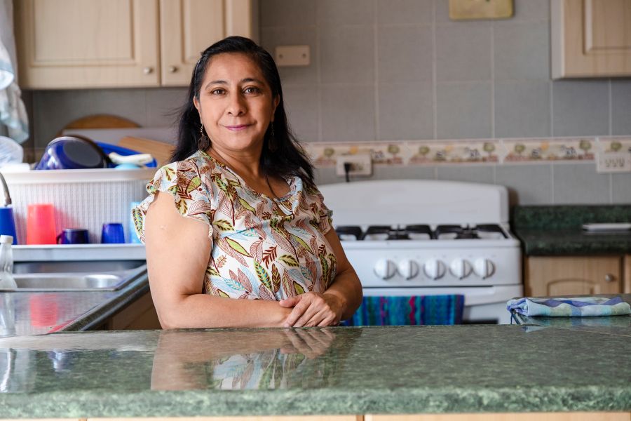 Woman leaning against counter