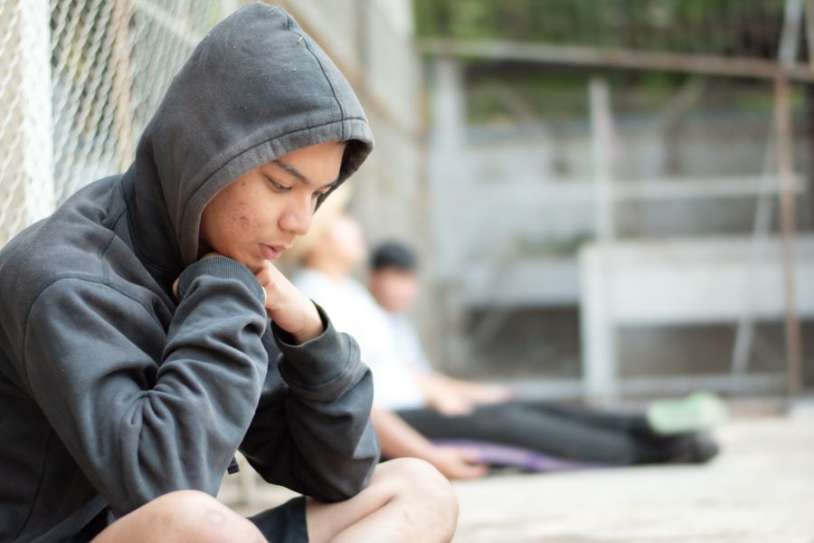 Young person with hoodie